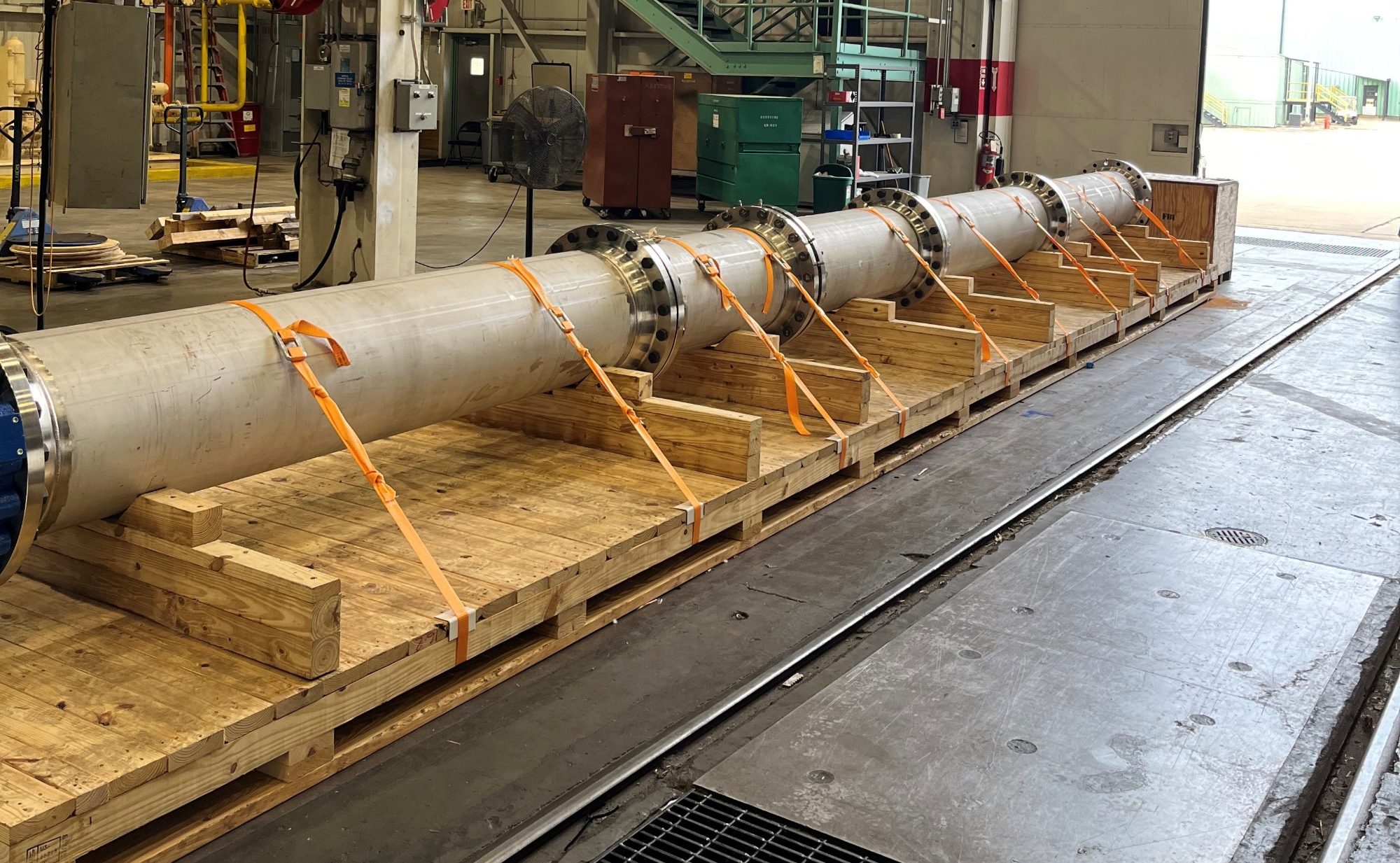 Industrial pipe strapped and cradled for export by the Dockside Logistics Greenville packaging crew